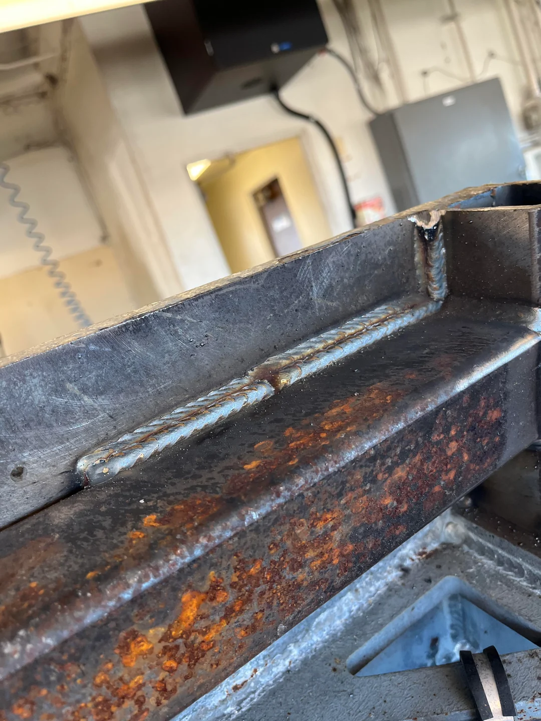Long weld bead along a steel channel