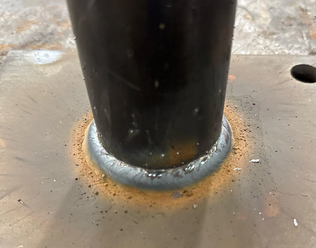 MIG weld around a round tube welded to a steel plate